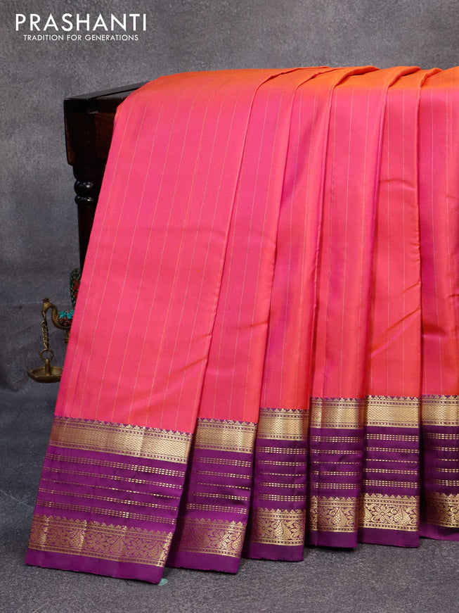 Pure kanjivaram silk saree dual shade of pinkish orange and deep purple with allover zari stripes pattern and zari woven border