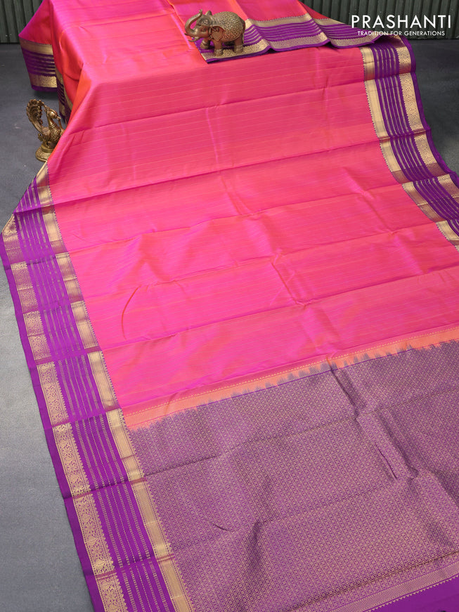 Pure kanjivaram silk saree dual shade of pinkish orange and deep purple with allover zari stripes pattern and zari woven border