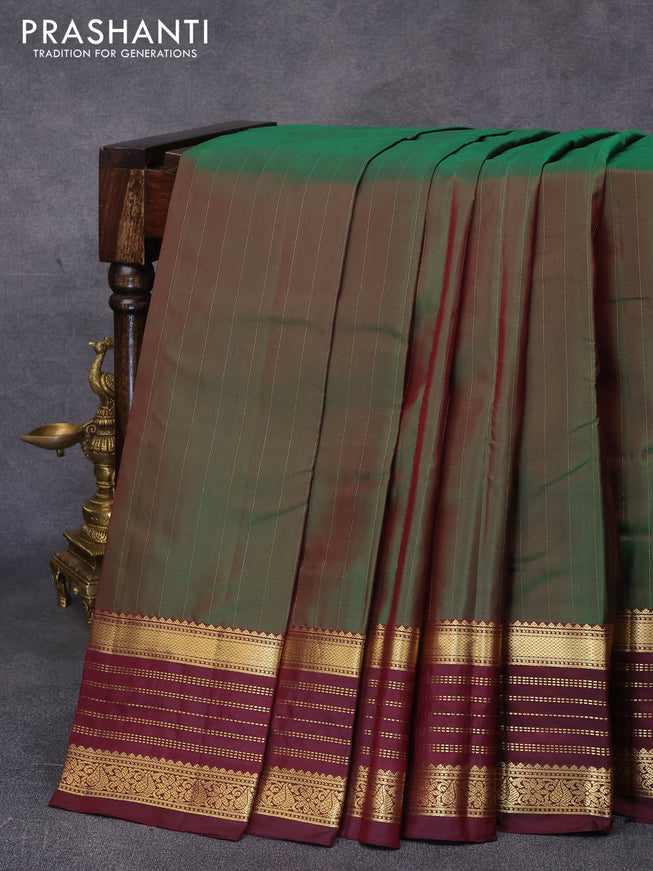 Pure kanjivaram silk saree dual shade of green and deep maroon with allover zari stripes pattern and zari woven border