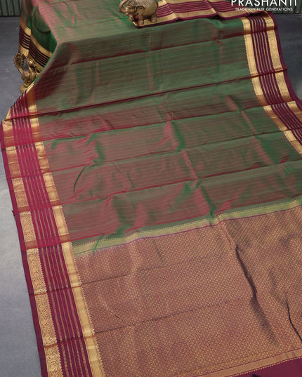 Pure kanjivaram silk saree dual shade of green and deep maroon with allover zari stripes pattern and zari woven border