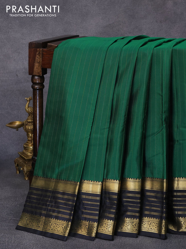 Pure kanjivaram silk saree green and black with allover zari stripes pattern and zari woven border