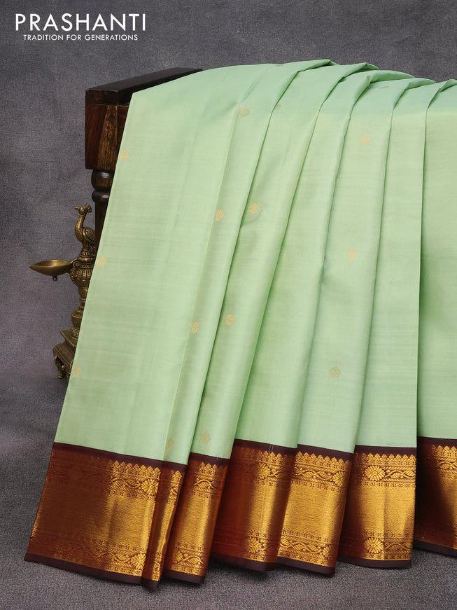 Pure kanjivaram silk saree pastel green and deep maroon with zari woven buttas and zari woven korvai border