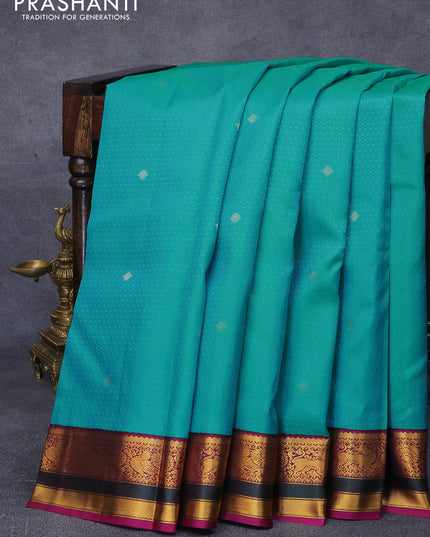 Pure kanjivaram silk saree teal blue and purple with allover self emboss & zari buttas ad zari woven korvai border