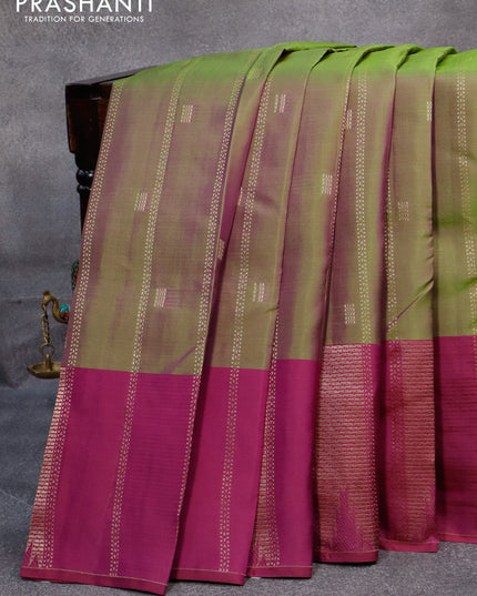 Pure kanjivaram silk saree dual shade of green and purple with allover zari weaves and zari woven border