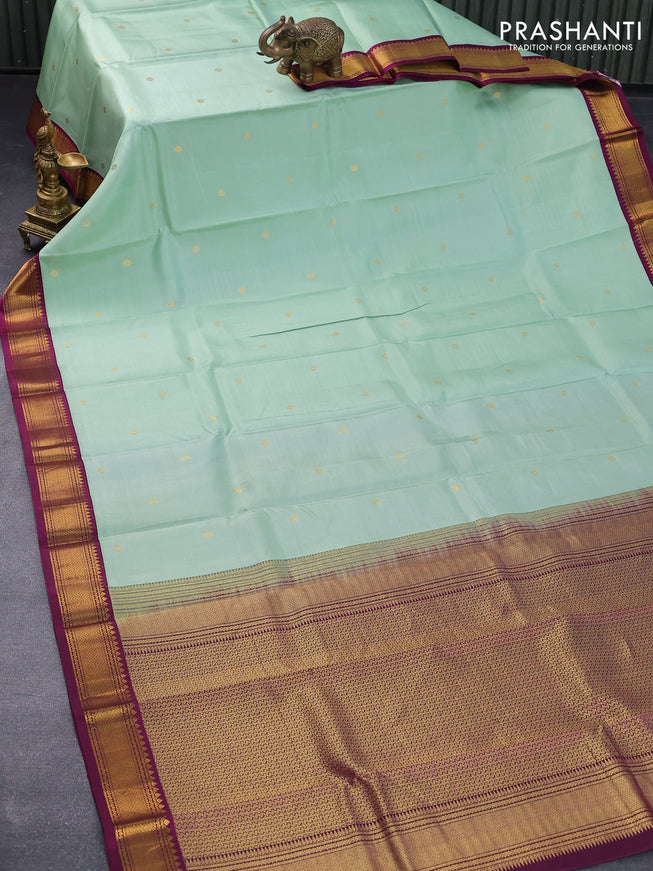 Pure kanjivaram silk saree pastel green and deep purple with zari woven buttas and zari woven korvai border