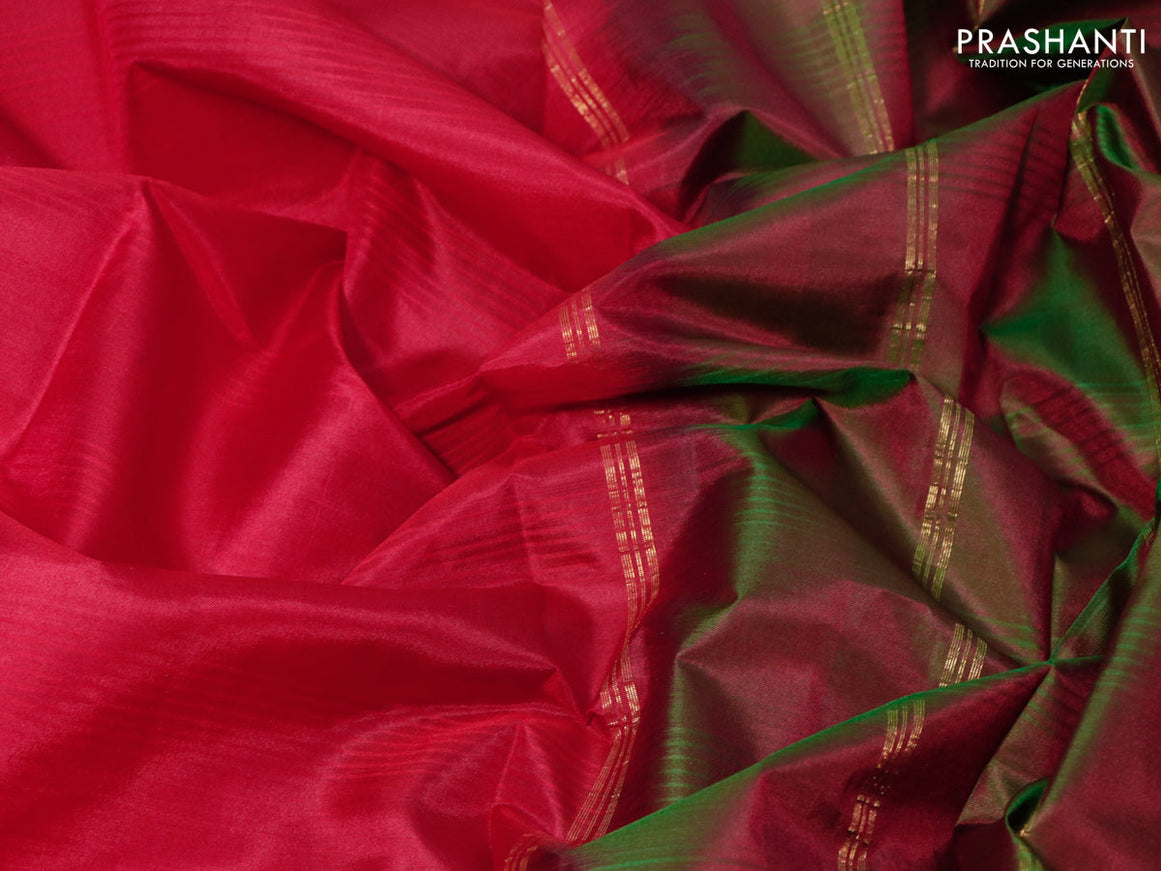 Pure kanjivaram silk saree red and dual shade of maroonish green with plain body and zari woven simple border