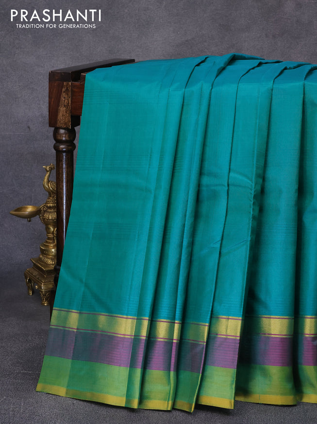 Pure kanjivaram silk saree teal green and dual shade of mustard with plain body and zari woven simple border