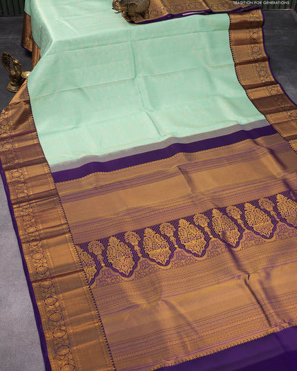 Pure kanjivaram silk saree light blue and violet with allover zari woven brocade weaves and rich zari woven border