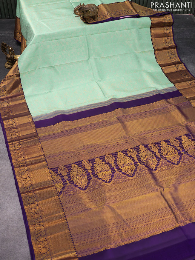 Pure kanjivaram silk saree light blue and violet with allover zari woven brocade weaves and rich zari woven border