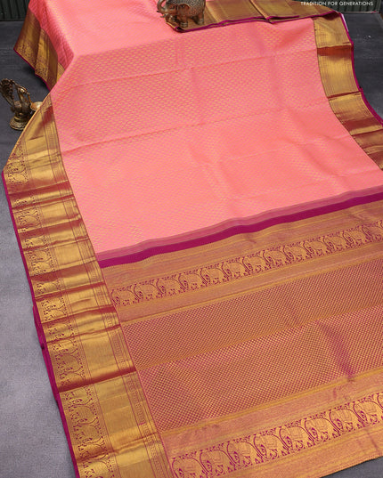 Pure kanjivaram silk saree peach pink and pink with allover zari woven butta weaves and zari woven elephant border