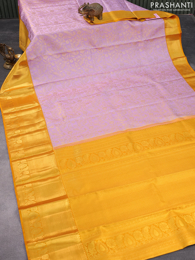 Pure kanjivaram silk saree lavender shade and mustard yellow with allover zari woven floral weaves and long zari woven border