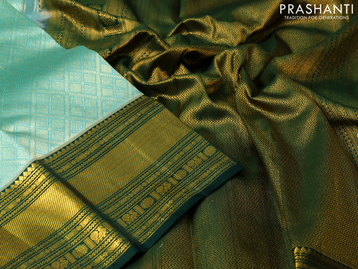 Pure kanjivaram silk saree teal blue and dark green with allover zari woven geometric weaves and zari woven border