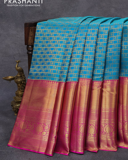 Pure kanjivaram silk saree teal blue shade and magenta pink with allover zari checks & buttas and long zari woven border