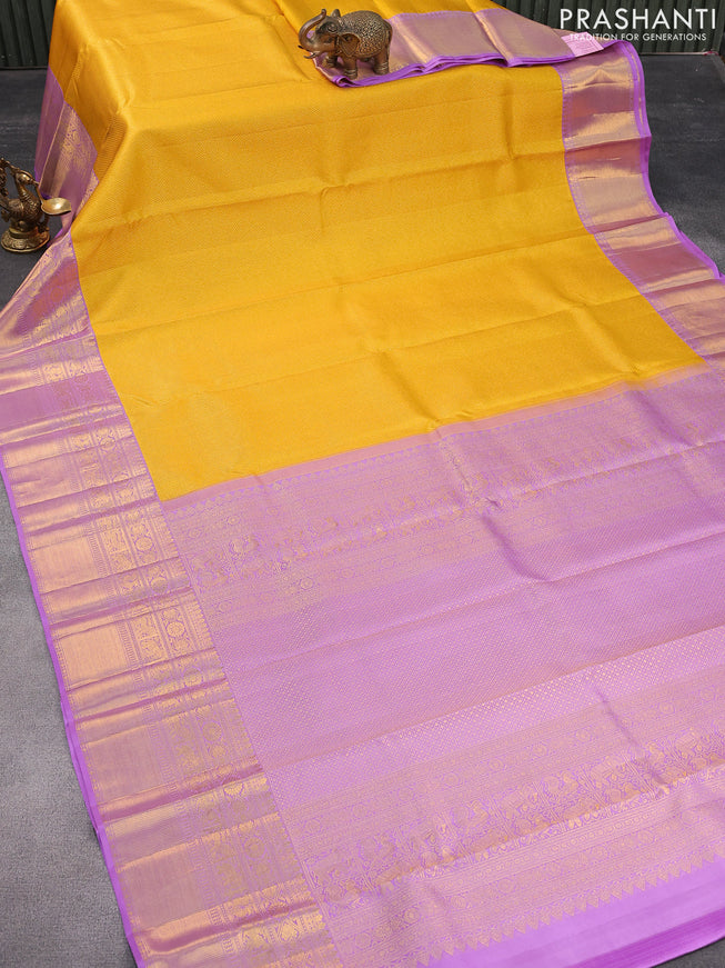 Pure kanjivaram silk saree mustard yellow and lavender shade with allover zari woven brocade weaves and long zari woven border