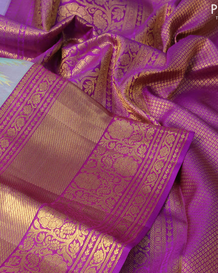 Pure kanjivaram silk saree pastel blue shade and purple with allover zari woven brocade weaves and zari woven floral border