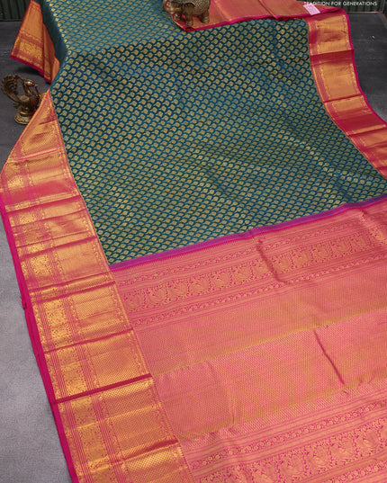 Pure kanjivaram silk saree peacock green and pink with allover zari woven butta weaves and long zari woven annam border