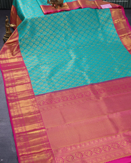 Pure kanjivaram silk saree teal green and pink with allover zari woven brocade weaves and long zari woven border