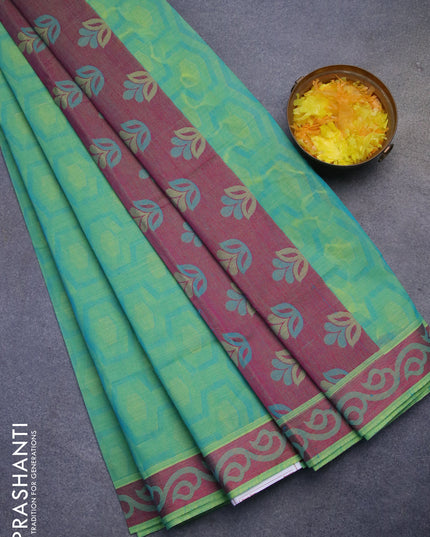 Coimbatore cotton saree dual shade of bluish green and pink with allover self emboss and thread woven border