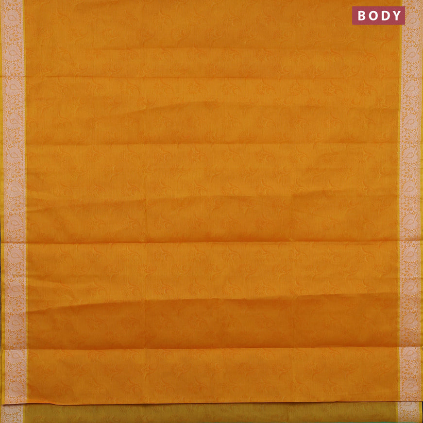 Coimbatore cotton saree dual shade of yellowish orange and green with allover self emboss and thread woven border