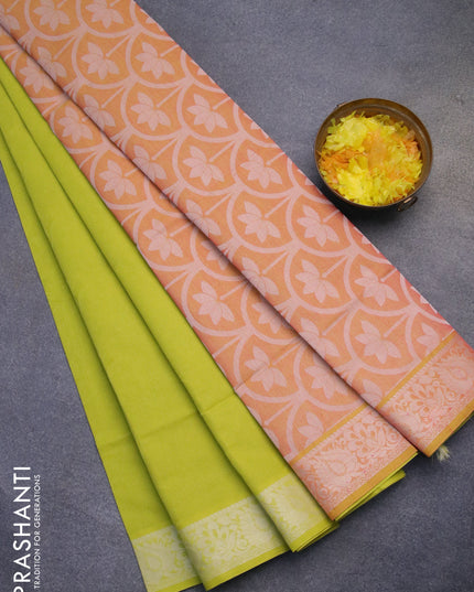 Coimbatore cotton saree fluorescent green and peach orange with allover self emboss and thread woven border
