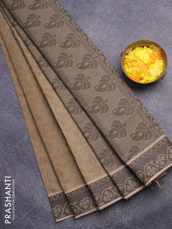 Coimbatore cotton saree sap green and black with allover self emboss and thread woven border