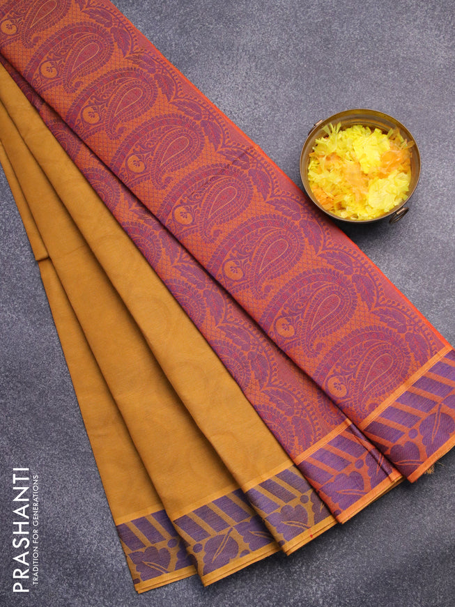 Coimbatore cotton saree dark mustard yellow and sunset orange with allover self emboss and thread woven border