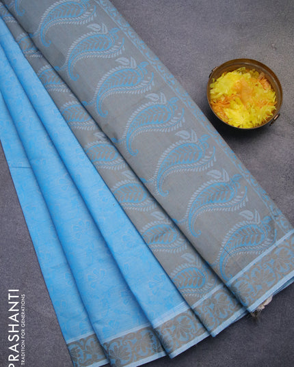 Coimbatore cotton saree light blue and chikku shade with allover self emboss and thread woven border