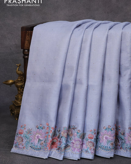 Pure tussar silk saree pastel bluish grey with allover zari buttas and floral design embroidery work border