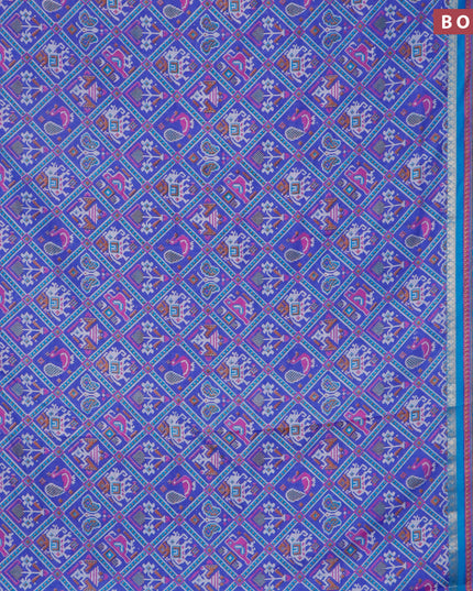 Semi tussar saree blue and cs blue with allover patola prints and ikat woven zari border