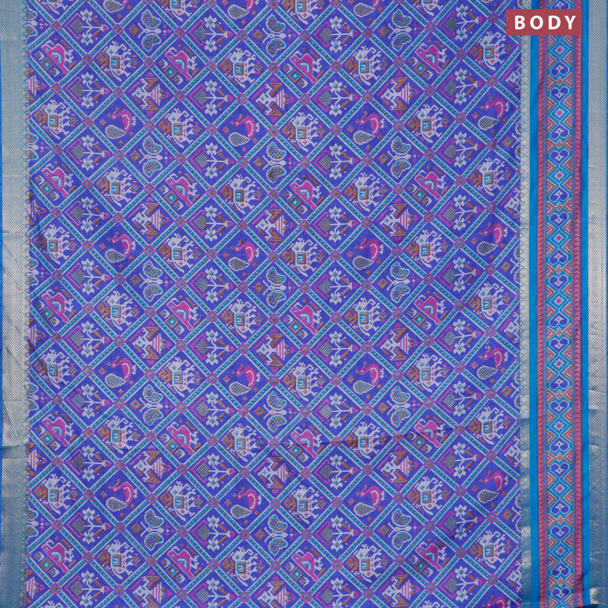 Semi tussar saree blue and cs blue with allover patola prints and ikat woven zari border