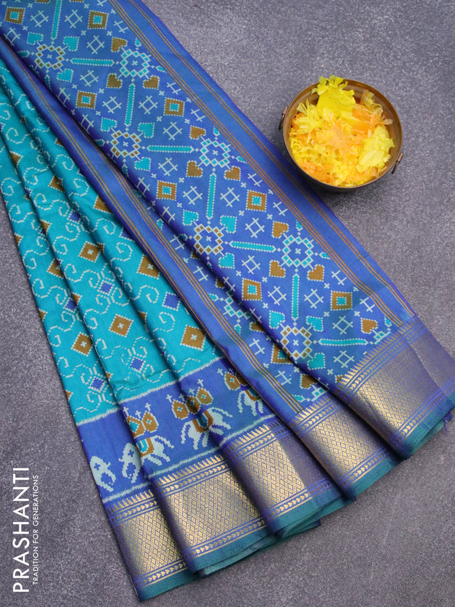 Semi tussar saree teal blue and blue with allover ikat weaves and zari woven border