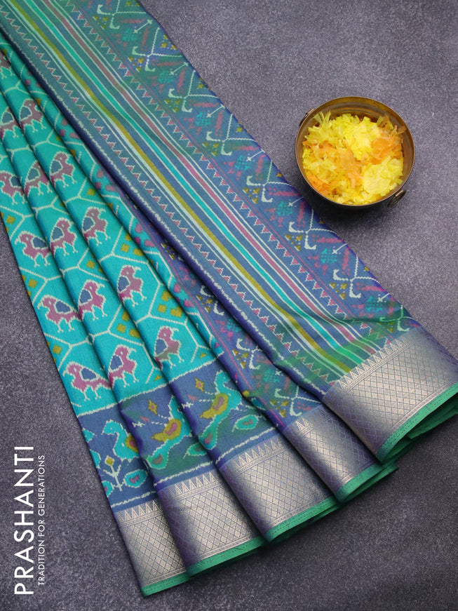 Semi tussar saree teal bluish green and dual shade of blue with allover ikat weaves and zari woven border