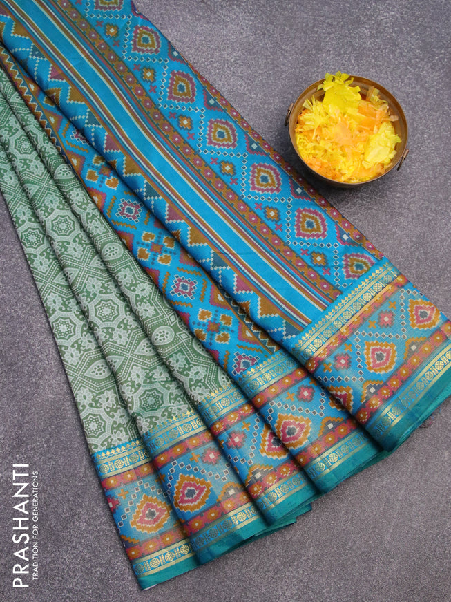 Semi tussar saree green and cs blue with allover ajrakh weaves and zari woven ikat border