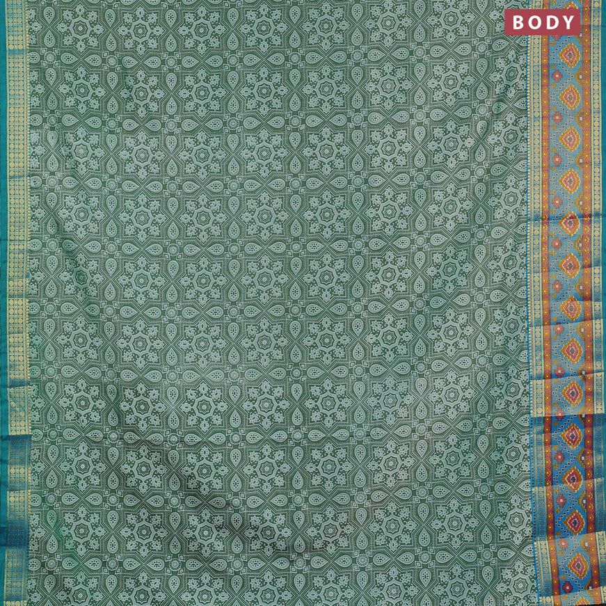 Semi tussar saree green and cs blue with allover ajrakh weaves and zari woven ikat border
