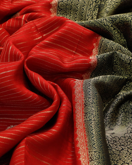 Dola silk saree red and black with allover zari stripes & butta weaves and zari woven border & zari butta blouse