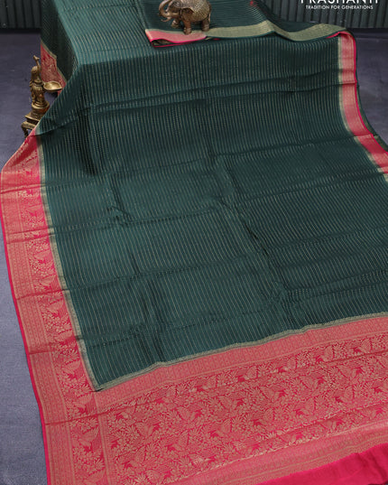 Dola silk saree bottle green and pink with allover zari stripe weaves and zari woven border & zari butta blouse