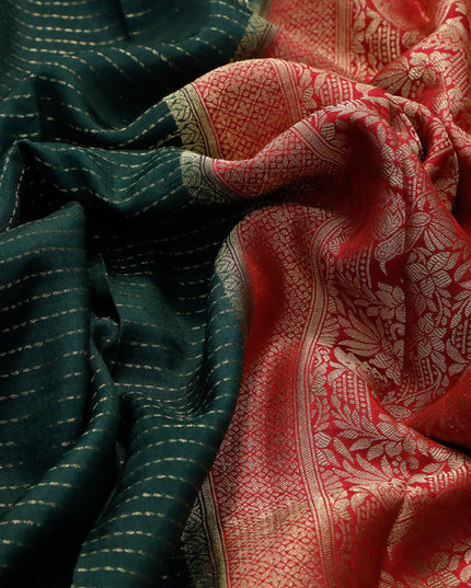 Dola silk saree bottle green and pink with allover zari stripe weaves and zari woven border & zari butta blouse