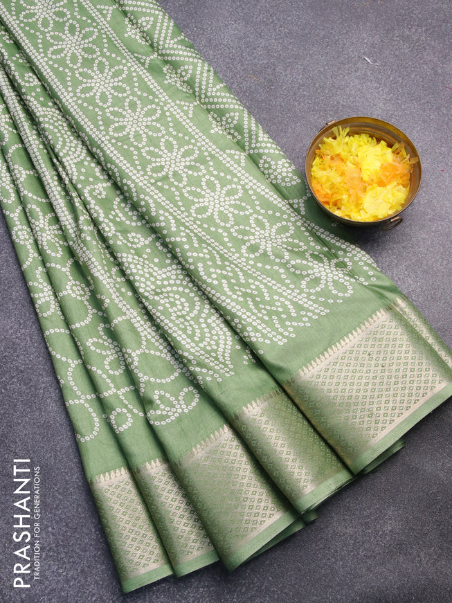 Semi dola saree green shade with allover bandhani prints and zari woven border