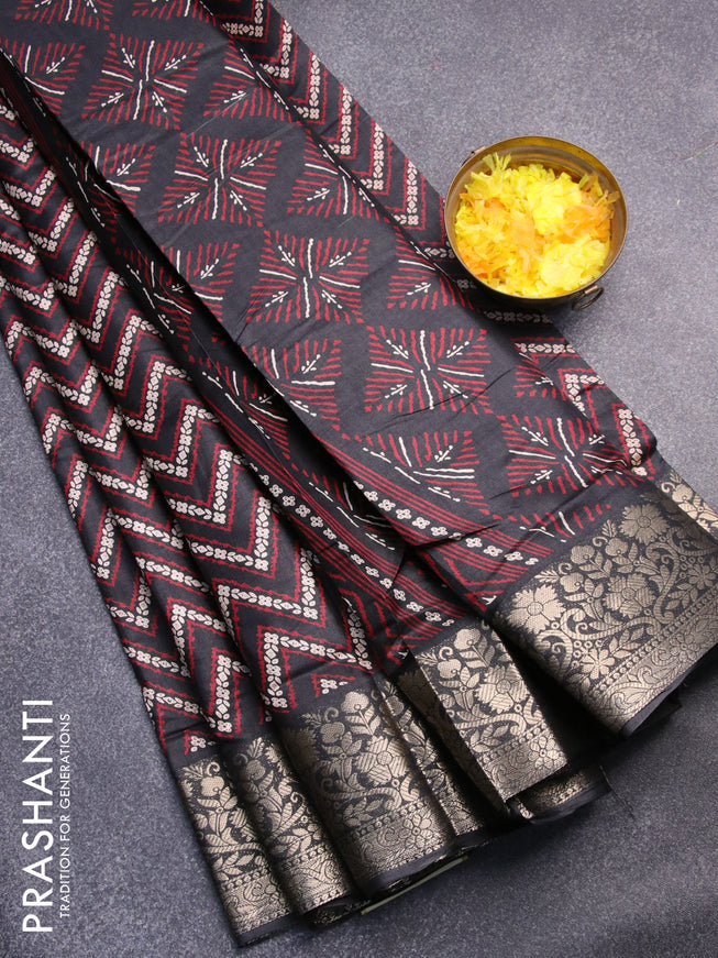 Semi dola saree black with allover zig zag prints and zari woven border