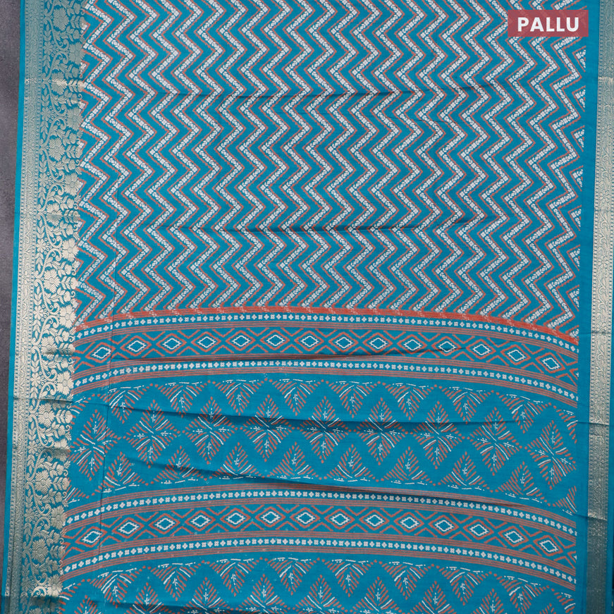 Semi dola saree teal blue with allover zig zag prints and zari woven border