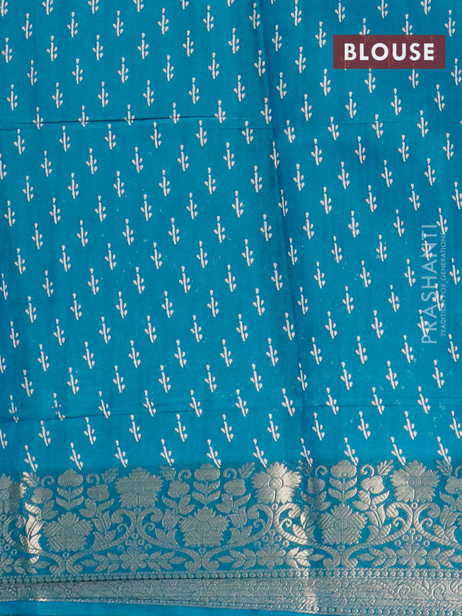 Semi dola saree teal blue with allover zig zag prints and zari woven border