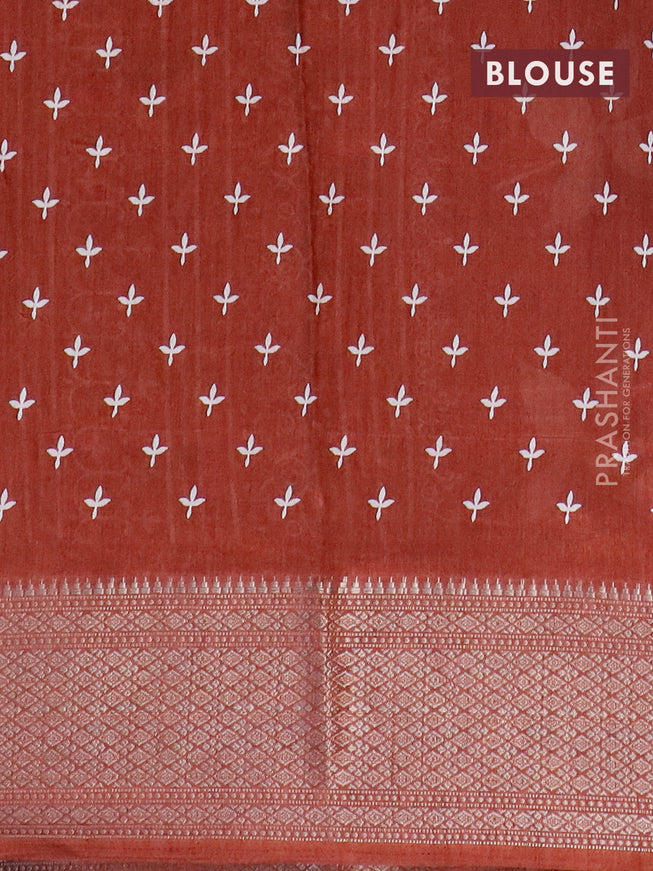 Semi dola saree rust shade with allover floral ptrints and zari woven border