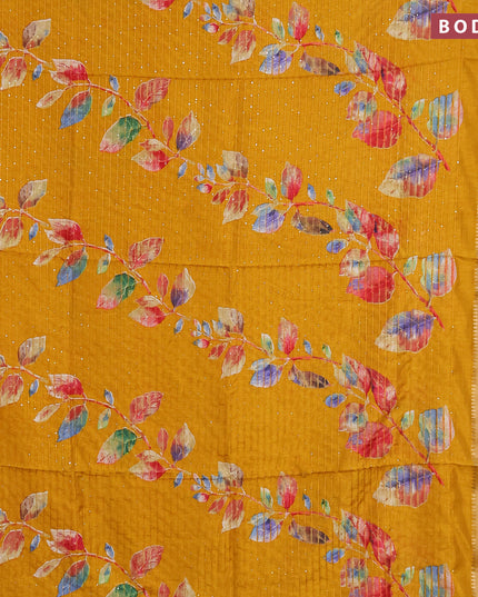 Semi dola saree mustard shade with allover leaf prints & sequin work and zari woven border