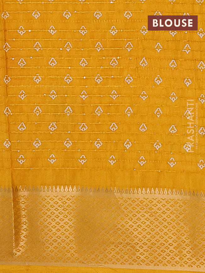 Semi dola saree mustard shade with allover leaf prints & sequin work and zari woven border
