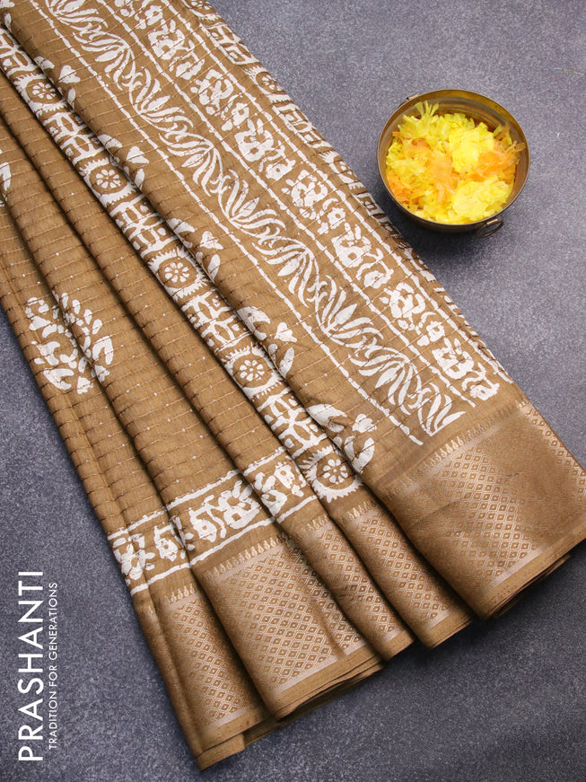 Semi dola saree dark sandal with batik prints & sequin work and zari woven border