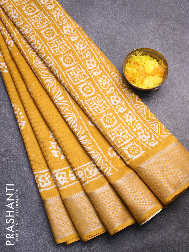 Semi dola saree mustard yellow with batik prints & sequin work and zari woven border