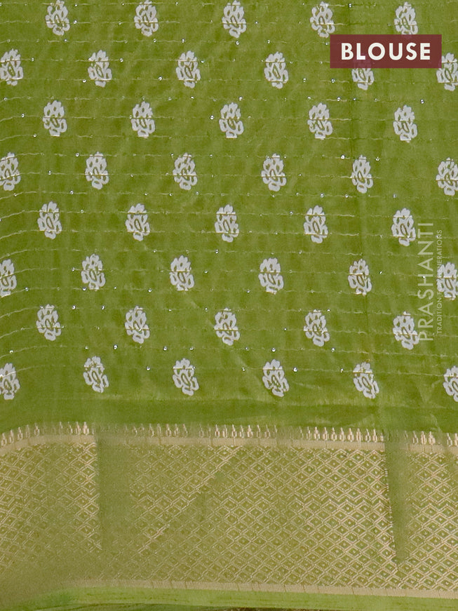 Semi dola saree light green with batik prints & sequin work and zari woven border