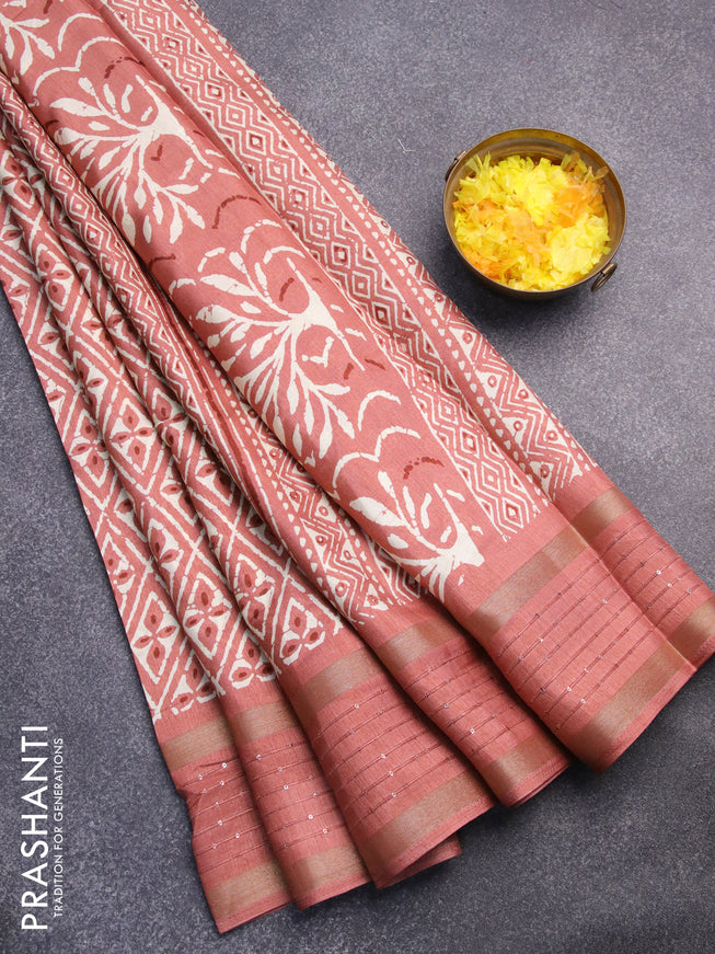 Semi dola saree peach shade with allover prints and zari woven sequin work border