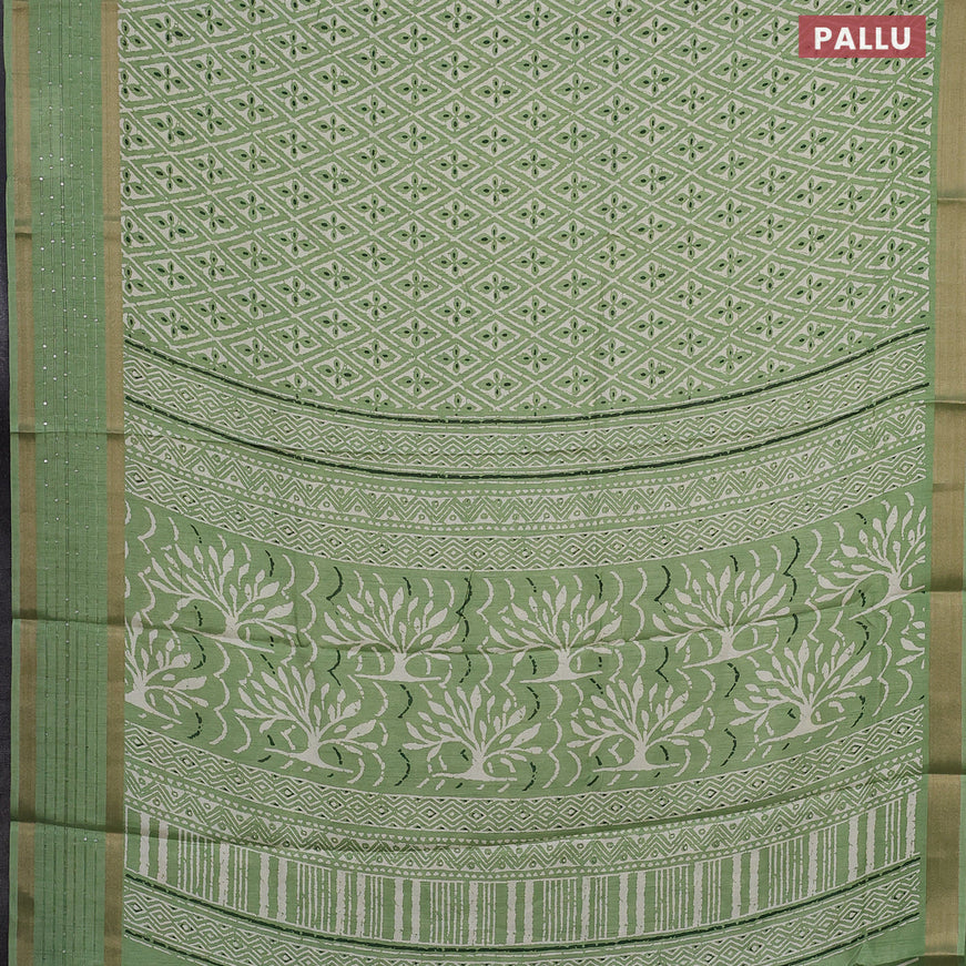 Semi dola saree pista green with allover prints and zari woven sequin work border