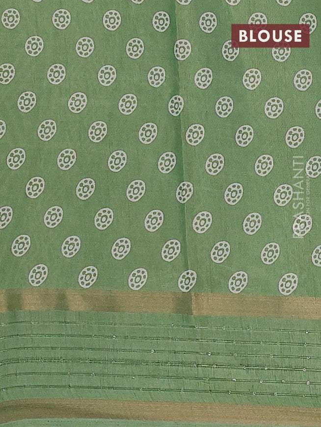 Semi dola saree pista green with allover prints and zari woven sequin work border